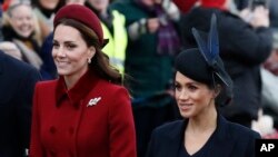 FILE -Britain's Kate, Duchess of Cambridge (L) and Meghan, Duchess of Sussex arrive to attend the Christmas day service at St Mary Magdalene Church in Sandringham in Norfolk, England, Dec. 25, 2018. 