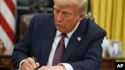 President Donald Trump signs an executive order on birthright citizenship in the Oval Office of the White House in Washington, Jan. 20, 2025.