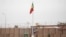 The Malian flag is hoisted during the handover ceremony of the Barkhane military base from the French to the Malian army in Timbuktu, on Dec. 14, 2021. 