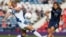 France's Camille Abily, left, attempts to stop a shot by United States' Tobin Heath during the women's group G soccer match between the United States and France prior to the start of the London 2012 Summer Olympics at Hampden Park Stadium in Glasgow, July