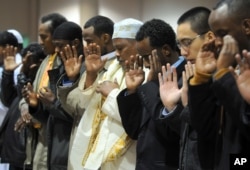 FILE - Several thousand Muslims pray together to mark the Eid al-Adha holiday Monday Dec.8, 2008 at the Minneapolis Convention Center.