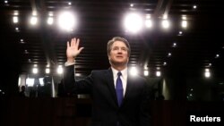 U.S. Supreme Court nominee judge Brett Kavanaugh is sworn in during a Senate Judiciary Committee confirmation hearing on Capitol Hill in Washington, Sept. 4, 2018.