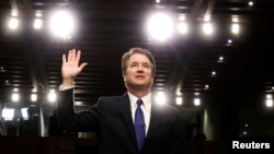 FILE - U.S. Supreme Court nominee judge Brett Kavanaugh is sworn in during a Senate Judiciary Committee confirmation hearing on Capitol Hill in Washington, Sept. 4, 2018.