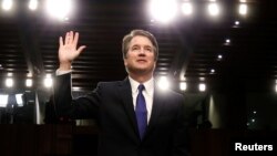 FILE - U.S. Supreme Court nominee judge Brett Kavanaugh is sworn in during a Senate Judiciary Committee confirmation hearing on Capitol Hill in Washington, Sept. 4, 2018.