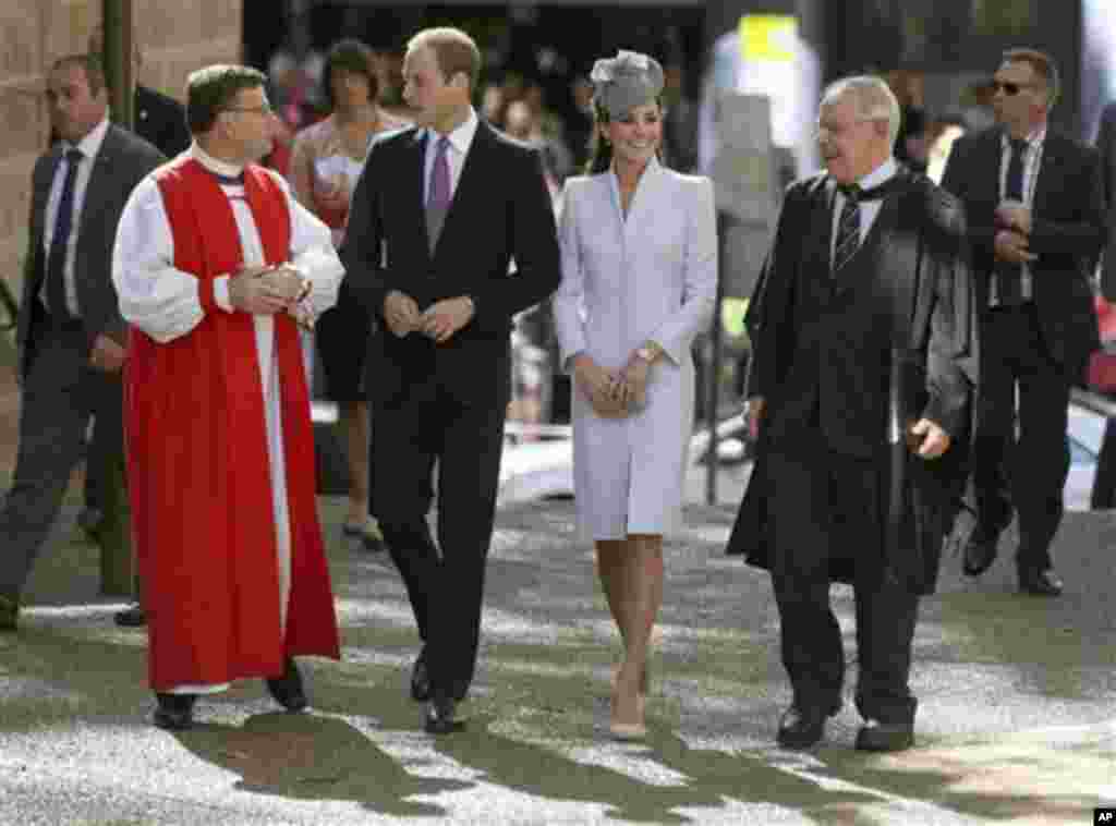 Britain's Prince William, second from left, and his wife, Kate, Duchess of Cambridge, second from right, walk with The Most Reverend Glenn Davies, Archbishop of Sydney, left, and The Very Reverend Phillip Jensen, Dean of Sydney, as they arrive at St. Andr