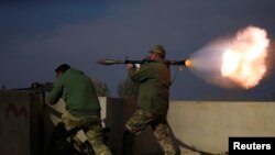 REUTERS Rocket being launched toward ISIS in Mosul, Iraq