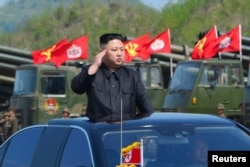 North Korea's leader Kim Jong Un watches a military drill marking the 85th anniversary of the establishment of the Korean People's Army (KPA) in this handout photo by North Korea's Korean Central News Agency (KCNA) made available on April 26, 2017.