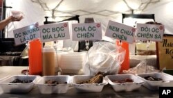 FILE - A selection of dishes is seen on display at a food stall at the Asian Garden Mall in Westminster, California, Sept. 5, 2015.