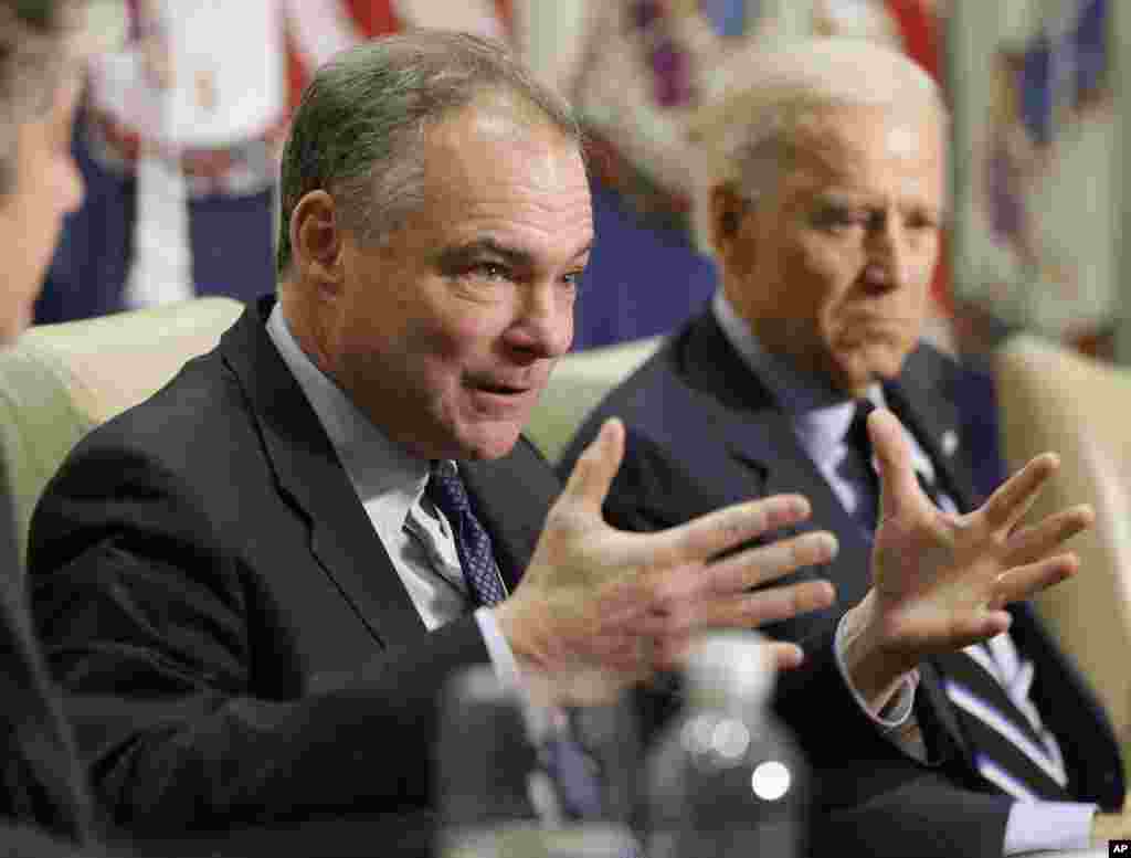 Sen. Tim Kaine, left, accompanied by Vice President Joe Biden, gestures during a round table discussion on gun violence, Jan. 25, 2013, at Virginia Commonwealth University in Richmond.