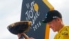 2016 Tour de France winner Chris Froome of Britain celebrates on the podium after the twenty-first and last stage of the Tour de France cycling race in Paris, France, Sunday, July 24, 2016. 