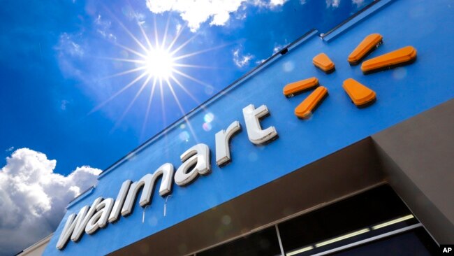 This June 25, 2019, file photo shows the entrance to a Walmart in Pittsburgh. Walmart launched a pilot program Wednesday, Sept. 9, 2020, using drones to deliver groceries and household essentials in a North Carolina city. (AP Photo/Gene J. Puskar, File)