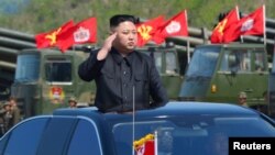 North Korea's leader Kim Jong Un watches a military drill marking the 85th anniversary of the establishment of the Korean People's Army (KPA)