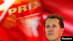 FILE - Ferrari Formula One driver Michale Schumacher watches a monitor during a free practice session for the Belgian Grand Prix in Spa-Francorchamps race circuit, Aug. 27, 2004.