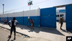 FILE - A Brazilian U.N. peacekeeper opens a gate at the U.N. base in the Cite Soleil slum of Port-au-Prince, Haiti.