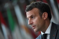 France's President Emmanuel Macron addresses the media as he arrives on the first day of the EU summit at the European Council Building in Brussels, Belgium, June 24, 2021.