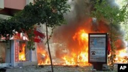 Flames are seen in a street after a blast killed several people and injured others, in central Ankara, Turkey, September 20, 2011.