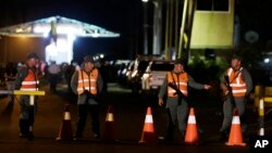 FILE - Venezuelan National Guard soldiers stand guard at the border between Colombia and Venezuela as seen from Paraguachon, Colombia, Sept. 8, 2015.