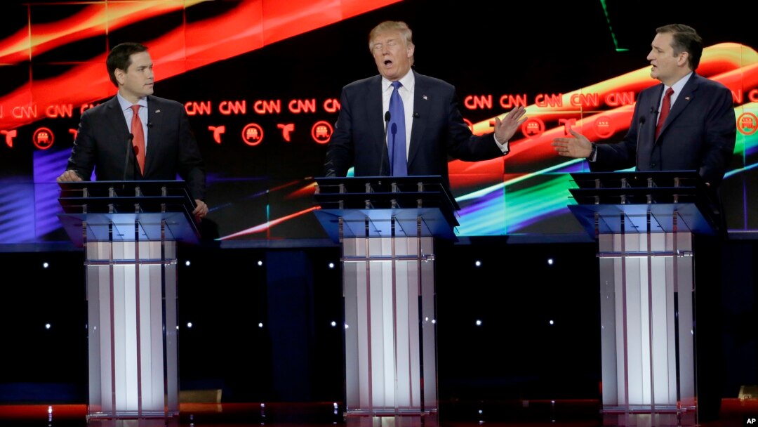 During a Republican presidential candidates' debate, businessman Donald Trump, center, reacts to Texas Sen. Ted Cruz, right, as Florida Sen. Marco Rubio looks on, in Houston, Texas, Feb. 25, 2016.