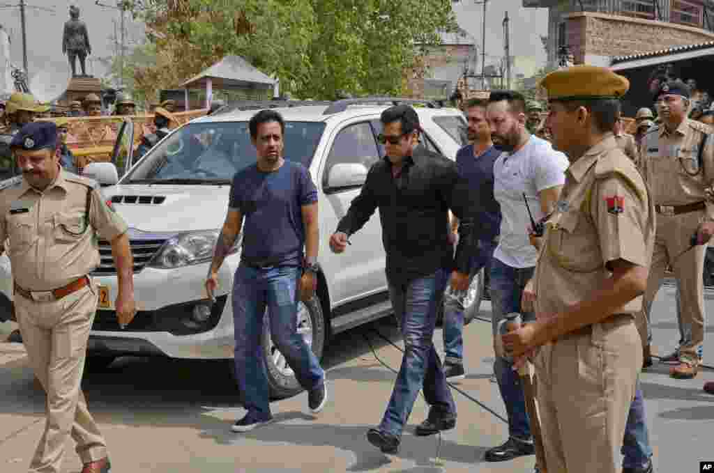 Bollywood star Salman Khan, center, arrives to appear before a court in Jodhpur, Rajasthan state, India. Khan was convicted of poaching rare deer in a wildlife preserve two decades ago and sentenced to five years in prison, with the trial judge describing him as a &quot;habitual offender.&quot;