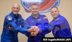 Expedition 72 crew members include NASA astronaut Don Pettit, left, Roscosmos cosmonauts Alexei Ovchinin, and Ivan Vagner, right, pose on Sept. 10, 2024, at the Cosmonaut Hotel in Baikonur, Kazakhstan. (Bill Ingalls/NASA via AP)