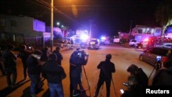 Members of the media work near the crime scene where a Mexican journalist Lourdes Maldonado was shot dead outside her home in the northern border city of Tijuana, Mexico, Jan. 23, 2022. 