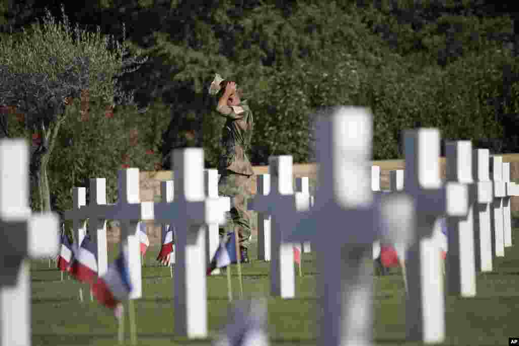 A soldier attends a ceremony at the Rhone American Cemetery in Draguignan, southern France, as part of the commemorations to mark the 75th anniversary of the Allied landings in the South of France.