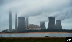 The coal-fired Plant Scherer is shown in operation on June 1, 2014, in Juliette, Ga. Emissions from coal-fired plants are part of the greenhouse gases that scientists say are causing global warming.