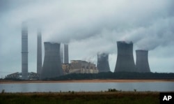 FILE - The coal-fired Plant Scherer is shown in operation in Juliette, Georgia, June 1, 2014.