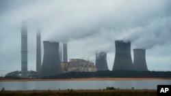 FILE - A coal-fired power plant is shown spewing fumes in Juliette, in the southeastern U.S. state of Georgia.