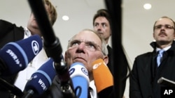 German Finance Minister Wolfgang Schaeuble speaks with the media prior to a meeting of eurozone finance ministers in Luxembourg, June 21, 2012 (AP).