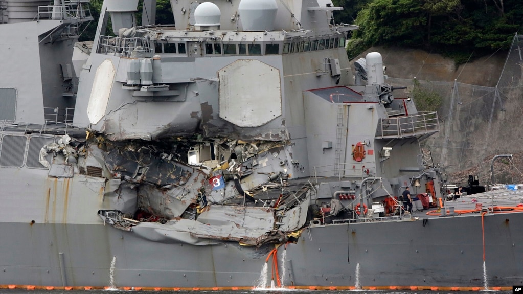 Damaged part of USS Fitzgerald is seen at the U.S. Naval base in Yokosuka, southwest of Tokyo, June 18, 2017. Navy divers found a number of sailors' bodies Sunday aboard the stricken USS Fitzgerald that collided with a container ship in the busy sea off 