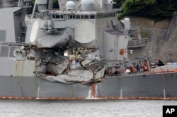 A damaged part of USS Fitzgerald is seen at the U.S. Naval base in Yokosuka, south of Tokyo, June 18, 2017.
