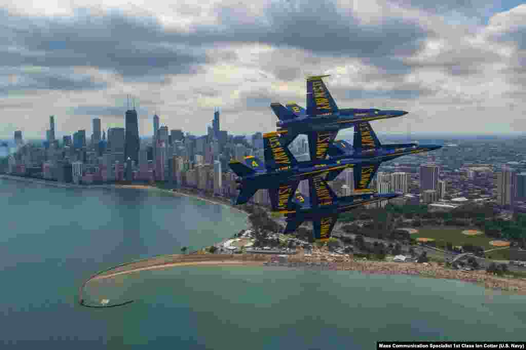 The U.S. Navy Flight Demonstration Squadron, the Blue Angels, diamond pilots perform the diamond 360 during the 2019 Chicago Air and Water Show in Chicago, Illinois, Aug. 16, 2019.