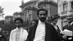 Haile Selassie, the exiled Emperor of Ethiopia, is shown around the garden at Prince's Gate, London, on June 4, 1936.