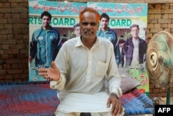 Mohammad Ashraf, father of Olympic gold-medalist Arshad Nadeem, sits down for one of many interviews at his home in Mian Channu, Pakistan, on Aug. 9, 2024.