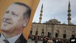 A poster of Turkish Prime Minister Recep Tayyip Erdogan on an election billboard of his Justice and Development Party in Istanbul, March 27, 2014.