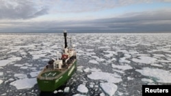 FILE - Greenpeace's Arctic Sunrise ship navigates through floating ice in the Arctic Ocean, Sept. 15, 2020. 