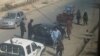 Taliban fighters search passengers and civilian vehicles in a check point in Kunduz city, north of Kabul, Afghanistan, Sept. 29, 2015. 