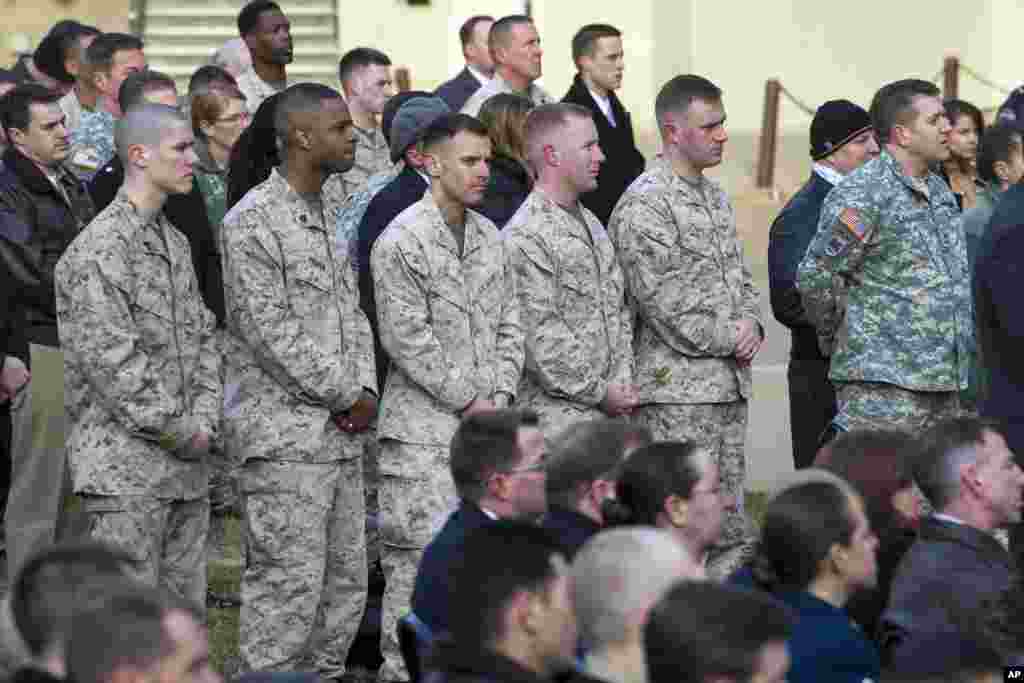 Military service members listen as Defense Secretary Ashton Carter and Afghan President Ashraf Ghani speak at the Pentagon, March 23, 2015.