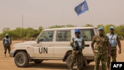 Ghanaian peacekeepers of the United Nations Mission in South Sudan patrol on March 7, 2018 in Leer, where famine has been declared since February 2017.