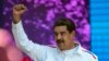 FILE - Venezuela's President Nicolas Maduro pumps his fist during a pro-government demonstration in Caracas, Venezuela, Feb. 12, 2019. 