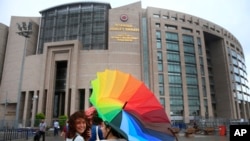 People walk outside Istanbul's court, July 17, 2017. 