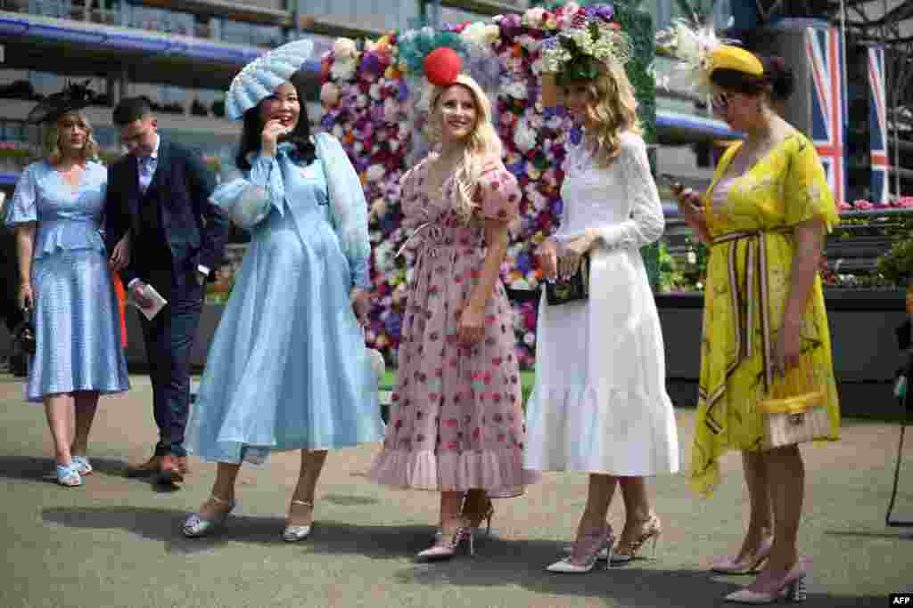 Race-goers attend the first day of the Royal Ascot horse racing meet in Ascot, west of London.