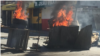 Scènes de vandalisme dans les rues de Port-au Prince, le 11 février 2019. (M Vilme / VOA)
