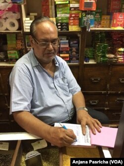 Suresh Kumar, who runs a mom-and-pop store in a New Delhi neighborhood market, is bewildered by the new tax. He does not know how to operate a computer and says employing someone to operate it will eat into his thin profit margins.