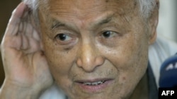 FILE - Li Rui, a former secretary to Chairman Mao Zedong, listens to a question during an interview in Beijing in 2006. 