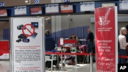 Signs list prohibited carry-on items at the entrance to a Casablanca-New York flight checkpoint at Casablanca Mohammed V International Airport, in Casablanca, Morocco, March 29, 2017.