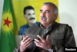 FILE - Murat Karayilan, acting military commander of the Kurdistan Workers Party (PKK), speaks with Reuters at the Qandil mountains near the Iraq-Turkish border in Sulaimaniya, 330 km (205 miles) northeast of Baghdad, March 24, 2013.