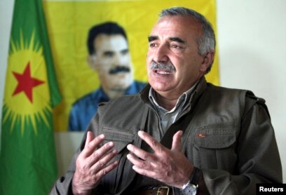 FILE - Murat Karayilan, acting military commander of the Kurdistan Workers Party (PKK), speaks with Reuters at the Qandil mountains near the Iraq-Turkish border in Sulaimaniya, 330 km (205 miles) northeast of Baghdad, March 24, 2013.