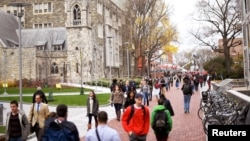 FILE - College students walk through campus in Philadelphia, Pennsylvania, Dec. 1, 2016. About a quarter of students at 66 tertiary institutions in the United States said they had gone hungry in the previous month, according to a survey.